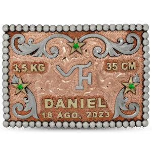 A custom kid's belt buckle for a newborn featuring silver scrolls, bronze stars and a personalized ranch brand figure 